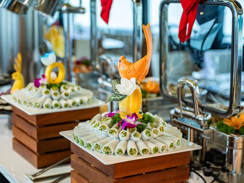 Fresh spring rolls decoratively plated on the buffet