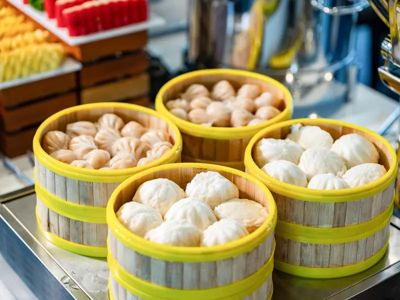 Steamed dumplings and buns on the buffet spread