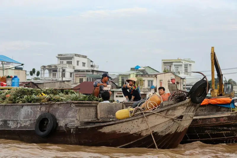 Big wooden trading boats moored side by side