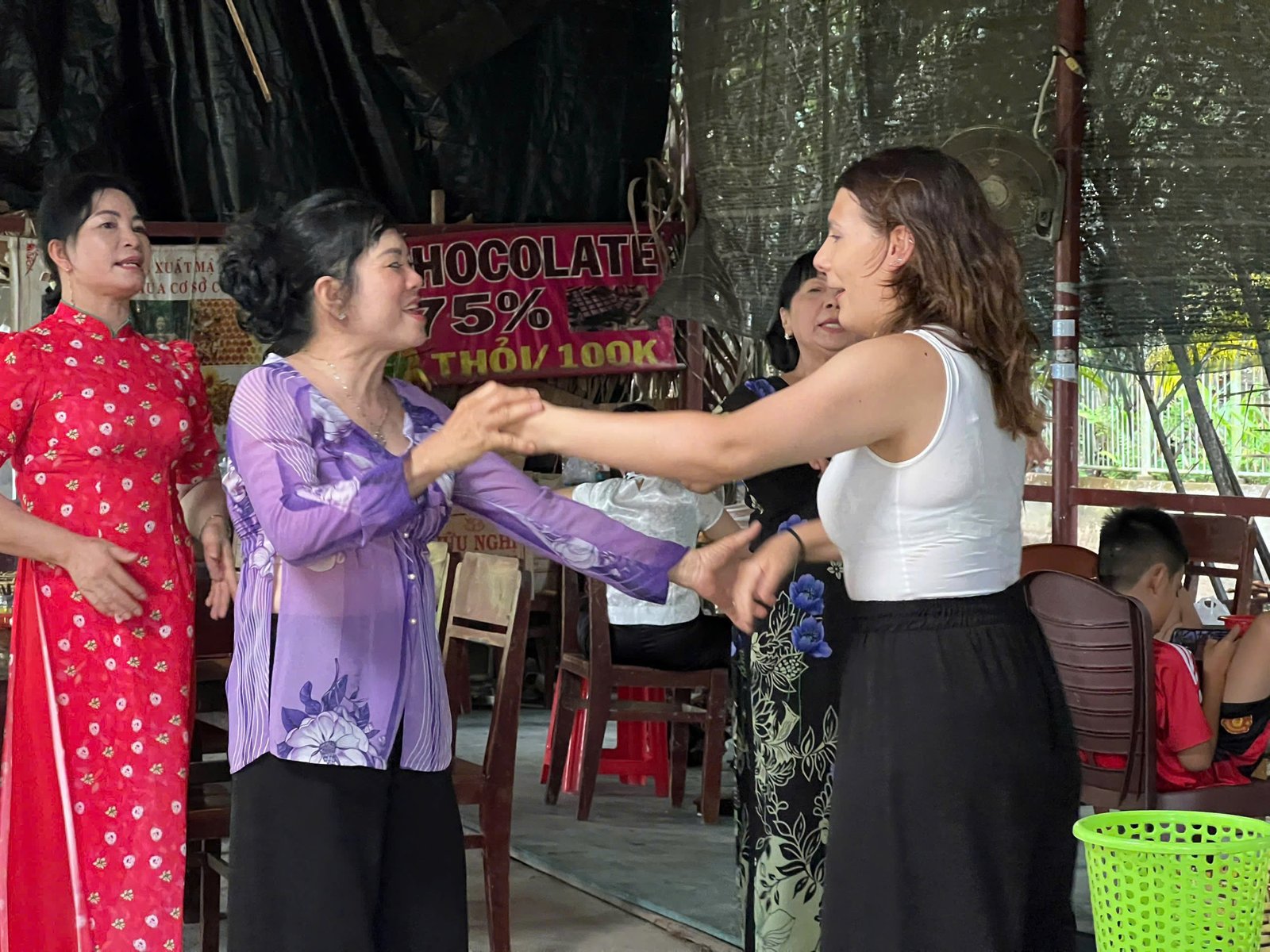 Traditional dance with local artisans at a Ben Tre coconut candy workshop