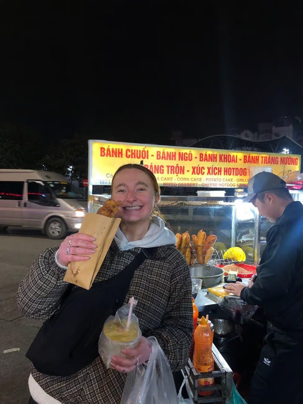 Guests tasting street food in Hanoi