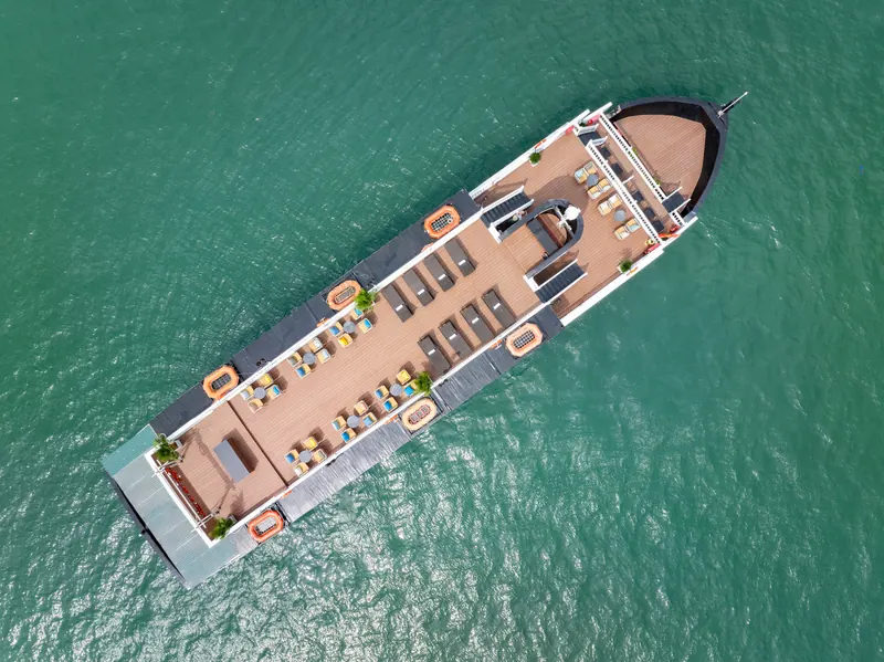 Cozy Grand photographed from directly overhead, showing the full length of the teak sundeck