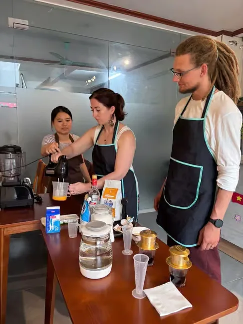 Guests measuring and mixing at the coffee bar with their hosts