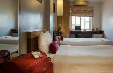 Superior Twin: both beds seen from the window side, with the desk and the minibar along the wall