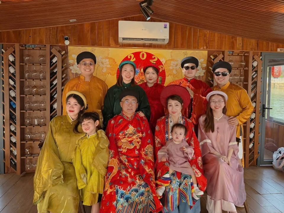 A family group photographed together in Huế court robes