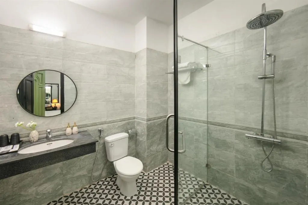 Bathroom with a walk-in rain shower and patterned floor tiles
