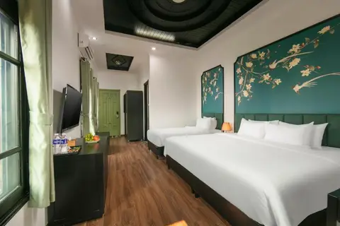 Family Suite: two beds under painted magnolia panels, with a coffered ceiling and a wooden floor