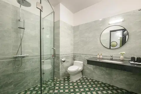 Superior room: marble en-suite with a walk-in rain shower and patterned green floor