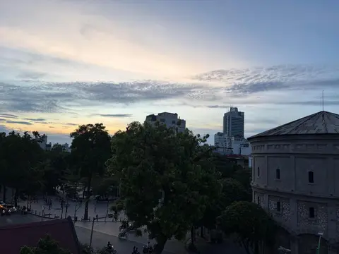 Evening over the trees and rooftops of the Old Quarter from the hotel