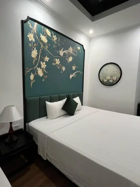 Deluxe King room with the painted floral headboard