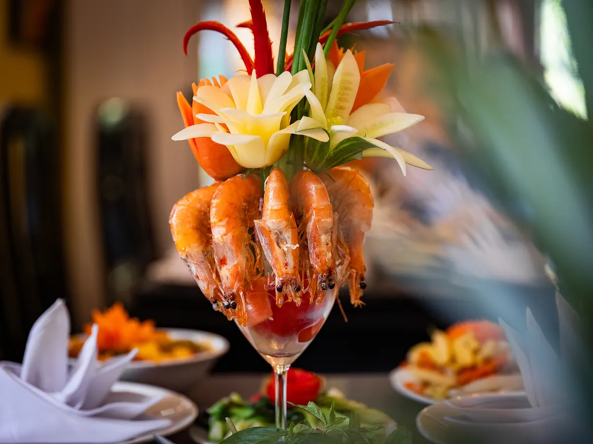 Steamed prawns served with a carved garnish